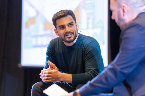 SUSE representatives discussing the importance of owning your AI at KubeCon