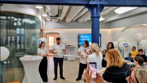 Anton symbolically cutting the ribbon.